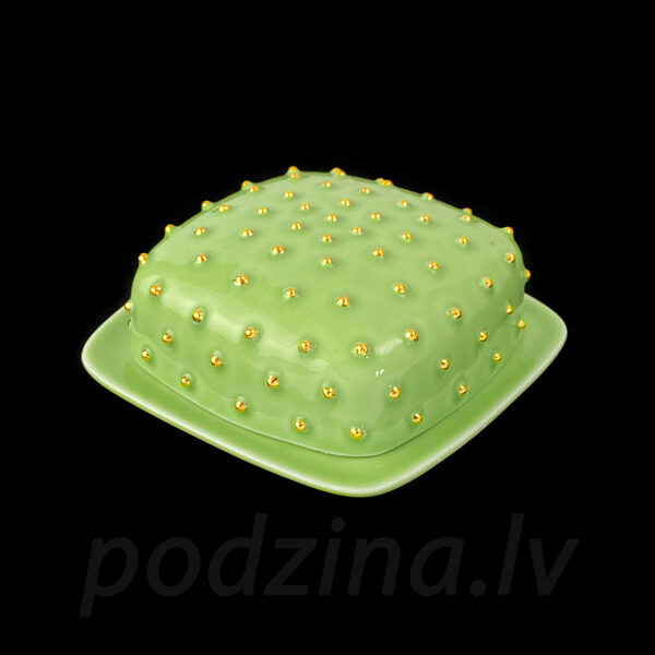 Gaiši zaļš sviesta trauks ar zelta pumpiņām